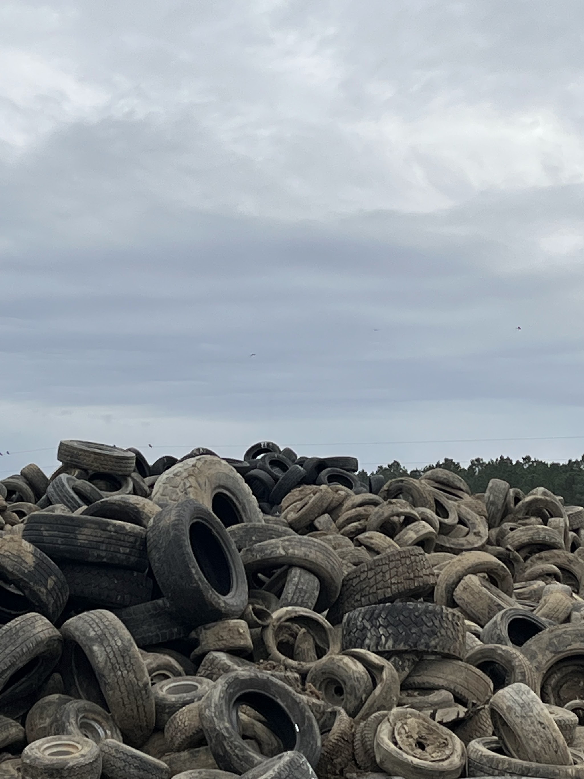 A large pile of used tires